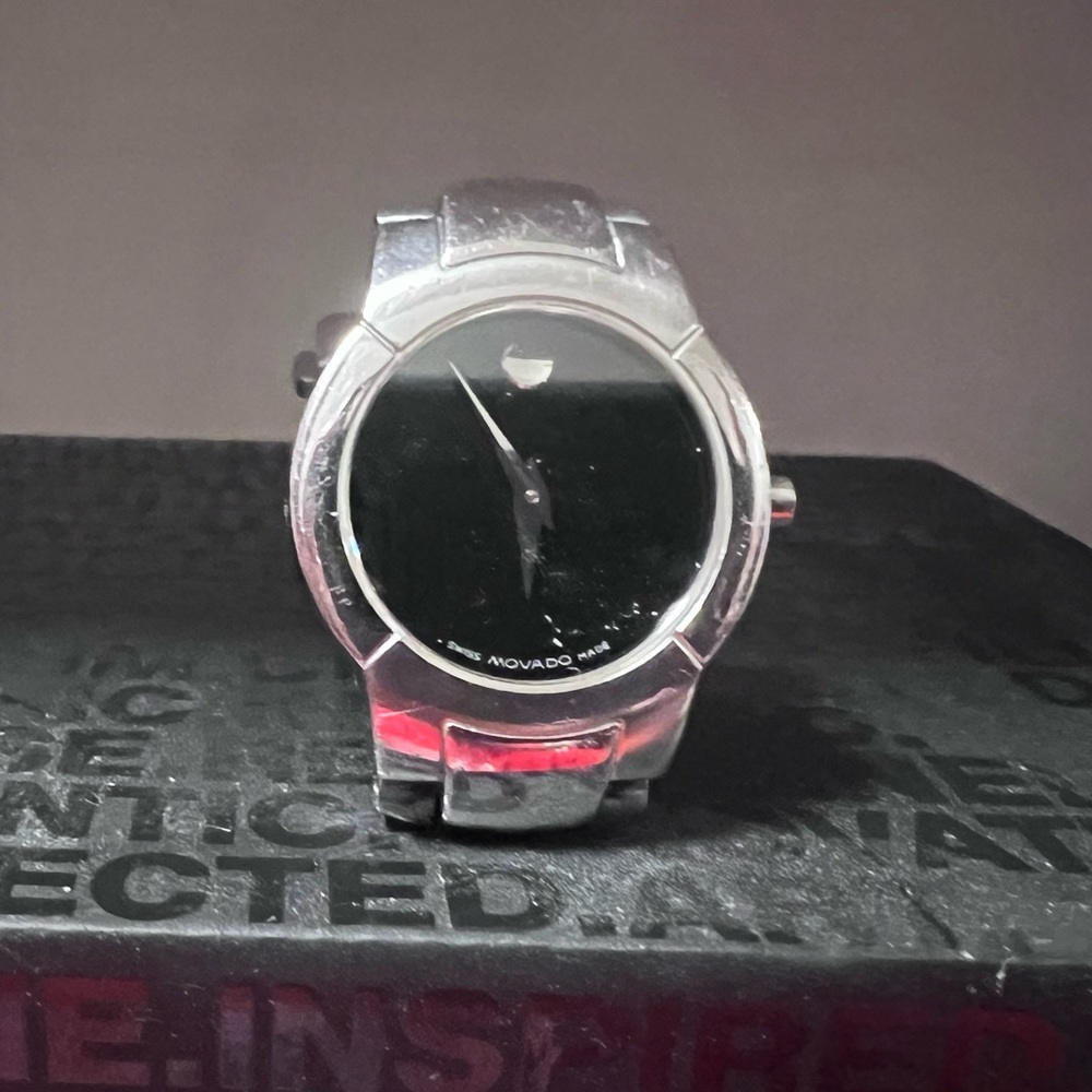 The classic Movado Museum Black Faced Chrome time piece. You must own one